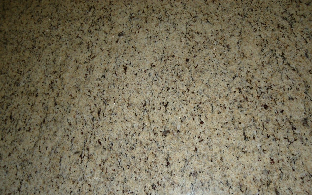 Illustrative beige granite slab material detail.